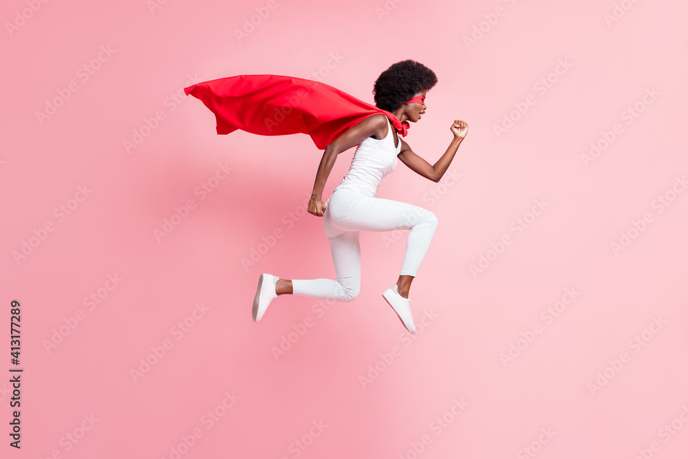 Full length body size view of motivated energetic girl jumping wear hero look running fast isolated on pink pastel color background - obrazy, fototapety, plakaty 