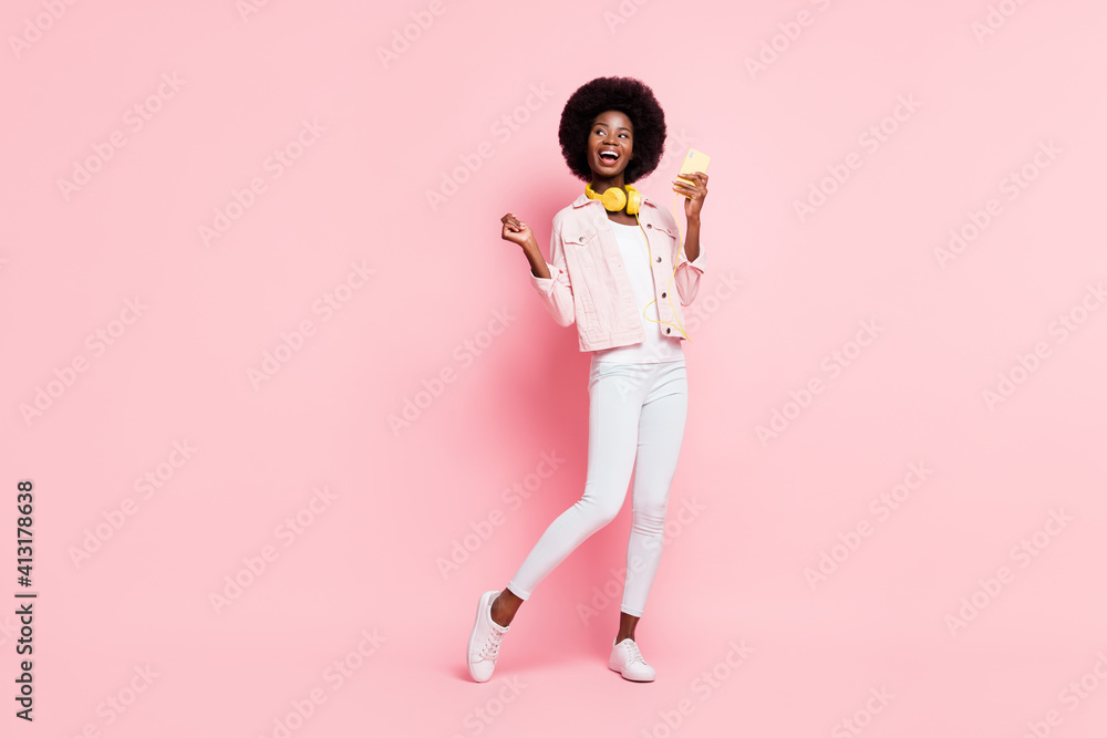 Full length body size view of lovely cheerful girl listening single pop hit bass dancing enjoying isolated over pink color background - obrazy, fototapety, plakaty 