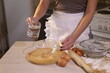 © Pretti - Girl makes dough for dumplings in the kitchen