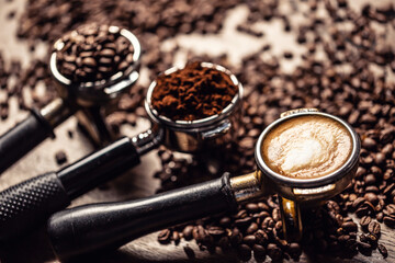 Coffee in its various forms from raw beans to ground coffee and cappuccino in three portafilters