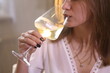 © Pretti - Girl drinking white wine