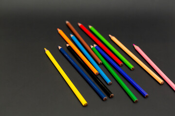 Wall Mural - We color wooden pencils. Black background.