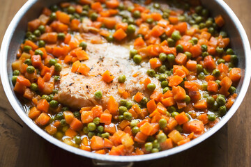 Wall Mural - Fried salmon fish with carrot and peas 