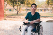 © GAYSORN - Asian disabled child on wheelchair and trays for activities with disabilities people,Skills to practice muscle development, Special children's lifestyle,Life in the education age of special need kids.