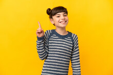 Little Caucasian Girl Isolated On Yellow Background Pointing Up A Great Idea