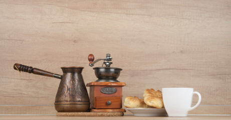 Poster - Two bun with poppy seeds with coffee cup on wood table. Breakfast. Good Morning