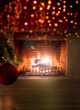© Rawf8 - Xmas at home. Red ball on tree branch, bokeh burning fireplace background. Copy space.