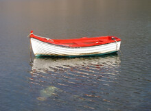 Red Boat Moored In Lake