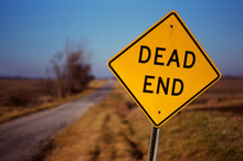 Dead End Sign On A Country Road At Sunset