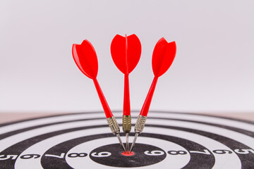 red dart darts in the center of the target hit the target won