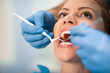 © Sanja_85 - Woman having teeth examined at dentists