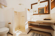 © EZ PHOTOS - Modern luxury summer holiday or vacation wooden beach house restroom interior with contemporary decoration and furniture