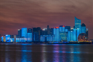 Wall Mural - China, Zhejiang, Hangzhou. City skyline at twilight.