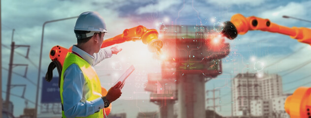 Wall Mural - industry engineer construction,using smart tablet,control automation robot arm machine intelligence 