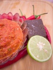 Wall Mural - Shrimp paste sambal or better known as sambal belacan. a famous traditional dips in Malaysia. Selective focus points. Blurred background