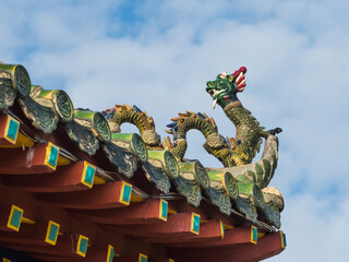 Sticker - Vietnam, Hoi An. Old town historic district (UNESCO World Heritage Site). Fujian (Phuc Kien) Assembly Hall, built around 1690. Dragon sculpture on roof line.