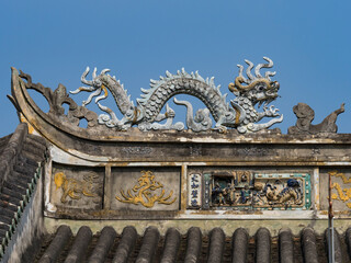 Wall Mural - Vietnam, Hoi An. Old town historic district (UNESCO World Heritage Site). Fujian (Phuc Kien) Assembly Hall, built around 1690. Detail of a dragon on the roof.