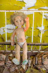 Poster - Ukraine, Pripyat, Chernobyl. Abandoned doll in the children's dormitory.