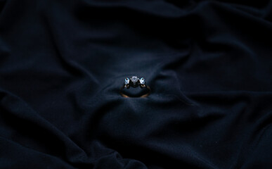 beautiful old gold ring on a black cloth