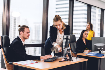 Group of professional business meeting and discussing strategy with new startup project.Creative business people planning and brainstorm with desktop computer in modern office.Teamwork concept