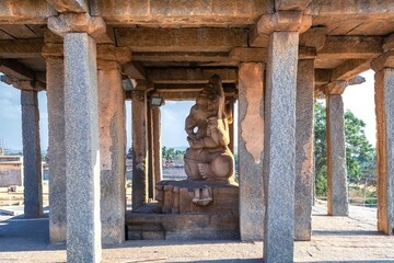 Wall Mural - Ruins of Sasivekalu (Saasivekaalu) Ganesha Temple at beautiful sunset in Hampi with huge statue of Lord Ganesha. Karnataka, India...