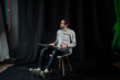 © Alexander - Pleasant positive business man using laptop.Happy smiling man in shirt works on laptop on a dark background