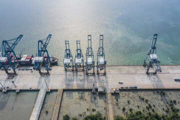 Sticker - Aerial view of a cargo ship almost ready to carry and transport huge containers through the sea