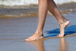 Female feet on the beach