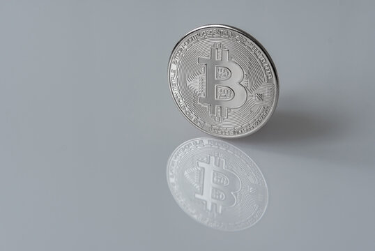 Wall Mural -  - Mockup of digital currency silver Bitcoin (BTC) isolated on white with clipping path and smooth shadow.