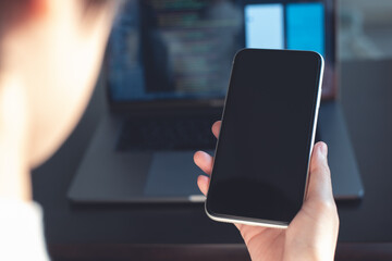 Digital software technology or mobile app development concept. Programmer, software developer coding, programming Javascript on laptop computer