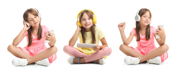 Canvas Print - Little girl listening to music on white background