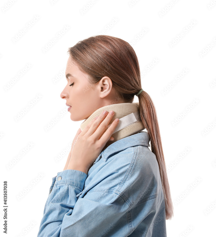 Young woman with cervical collar on neck against white background