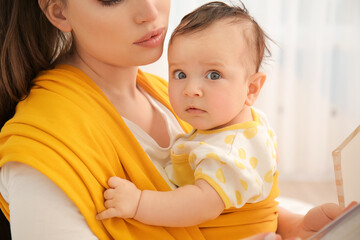 Canvas Print - Young mother with little baby in sling at home