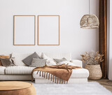 Fototapeta Boho - Frame mockup in bright living room design, white sofa in farmhouse boho interior style, 3d render