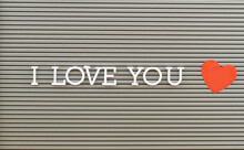 I Love You Written With Plastic Letters On Metal Board
