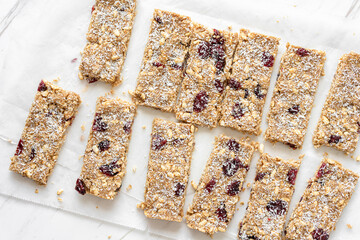 Vegan Energy Oat Bars With Coconut, Rice Puffs and Dried Cranberries Fruits, Flat Lay