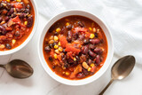 Fototapeta Perspektywa 3d - Vegetable Chili Bean Stew With Red Kidney Beans, Tomatoes, Sweetcorn, Red and Yellow Peppers On Flat Lay