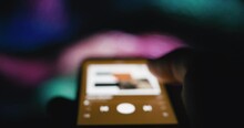 Smartphone music streaming application - blurry defocused concept footage

