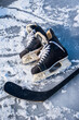Details close up hockey scates on a frozen pond. Ice skating in nature at sunset in winter. Travel and sports