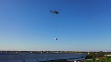 View Of A Heavy Lift Helicopter Picking Up An Old AC