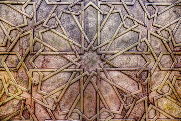 Sticker - Intricate tile patterns, metal work and plaster carvings adorning  building exteriors in Fez Morocco