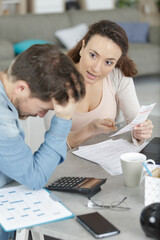 upset woman talking to husband at home