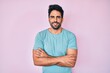 © Krakenimages.com - Handsome hispanic man with beard wearing casual clothes happy face smiling with crossed arms looking at the camera. positive person.