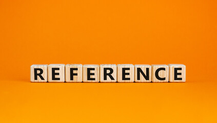 Reference symbol. Wooden cubes with the word 'reference'. Beautiful orange background. Business and reference concept. Copy space.