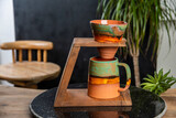 Fototapeta Sport - colorful handmade porcelain coffee cup with coffee drip