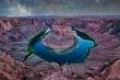 panorama photo of Horseshoe bend with milky way and stars reflection in colorado river, arzona, united states of america. Travel and art concept.