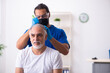 © Elnur - Old man visiting young male doctor in hair transplantation conce