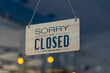 © supakit - Closed sign broad through the glass of door in cafe., Sorry we're closed sign., Business service and food concept.