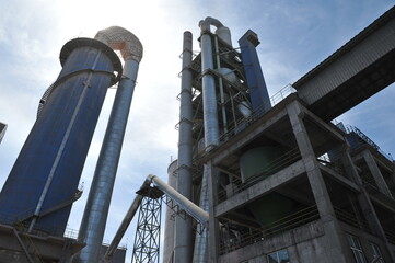 Zhambyl region, Kazakhstan - 05.15.2013 : Tanks and pipes connecting different sectors of the cement plant