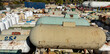 A large group of propane tanks in an industrial yard
